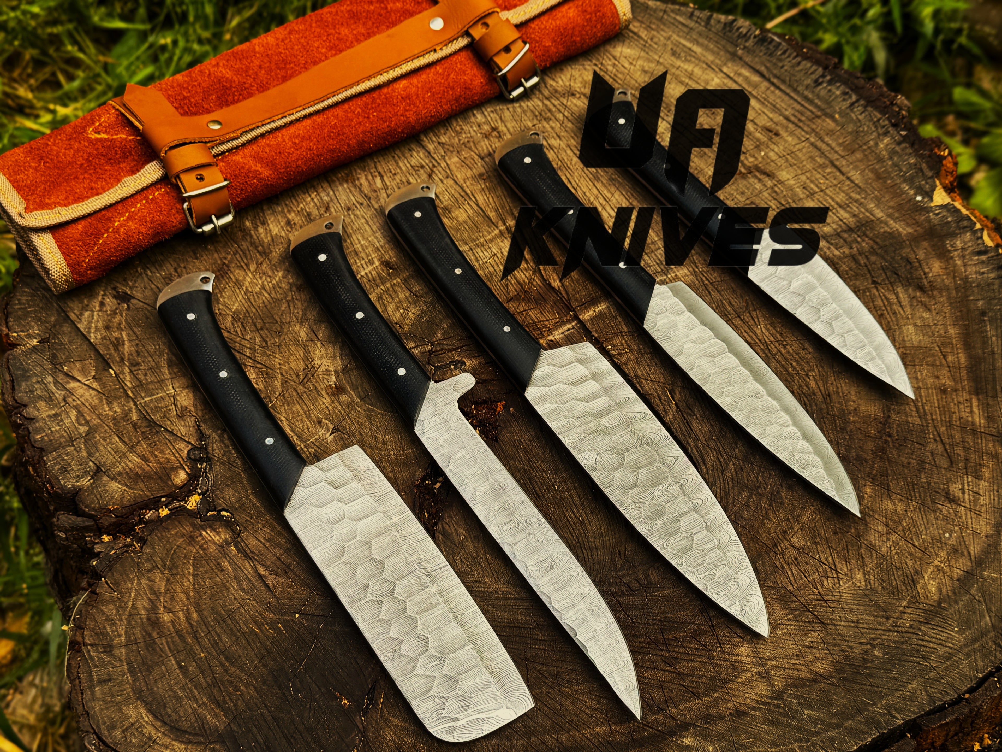 UA Knives Midnight Forge Damascus Steel 5-piece BBQ chef set with genuine leather bag, featuring full tang knives and detailed craftsmanship.