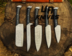 UA Knives Midnight Forge handmade Damascus steel 5-piece BBQ chef set with genuine leather bag displayed on a countertop.