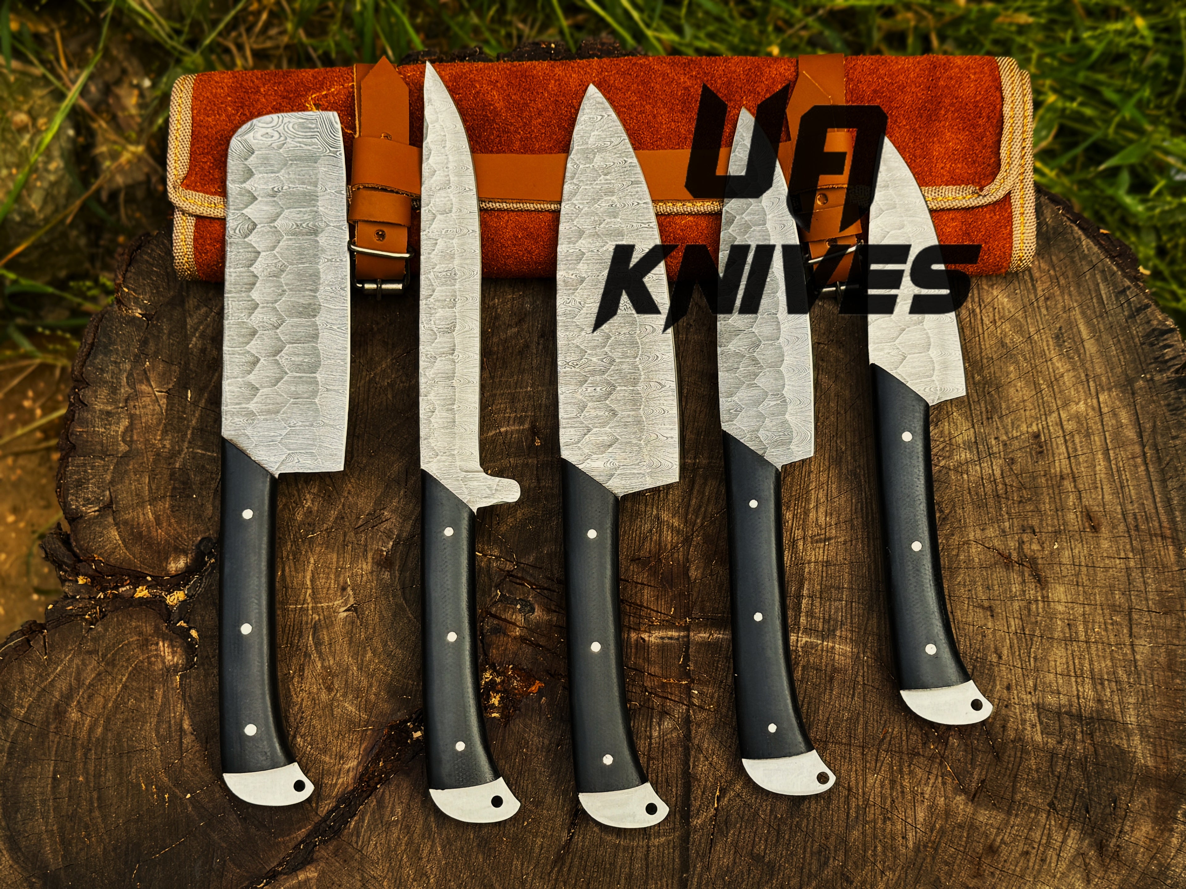 UA Knives Midnight Forge handmade Damascus steel chef set with five full-tang knives in a genuine leather bag.