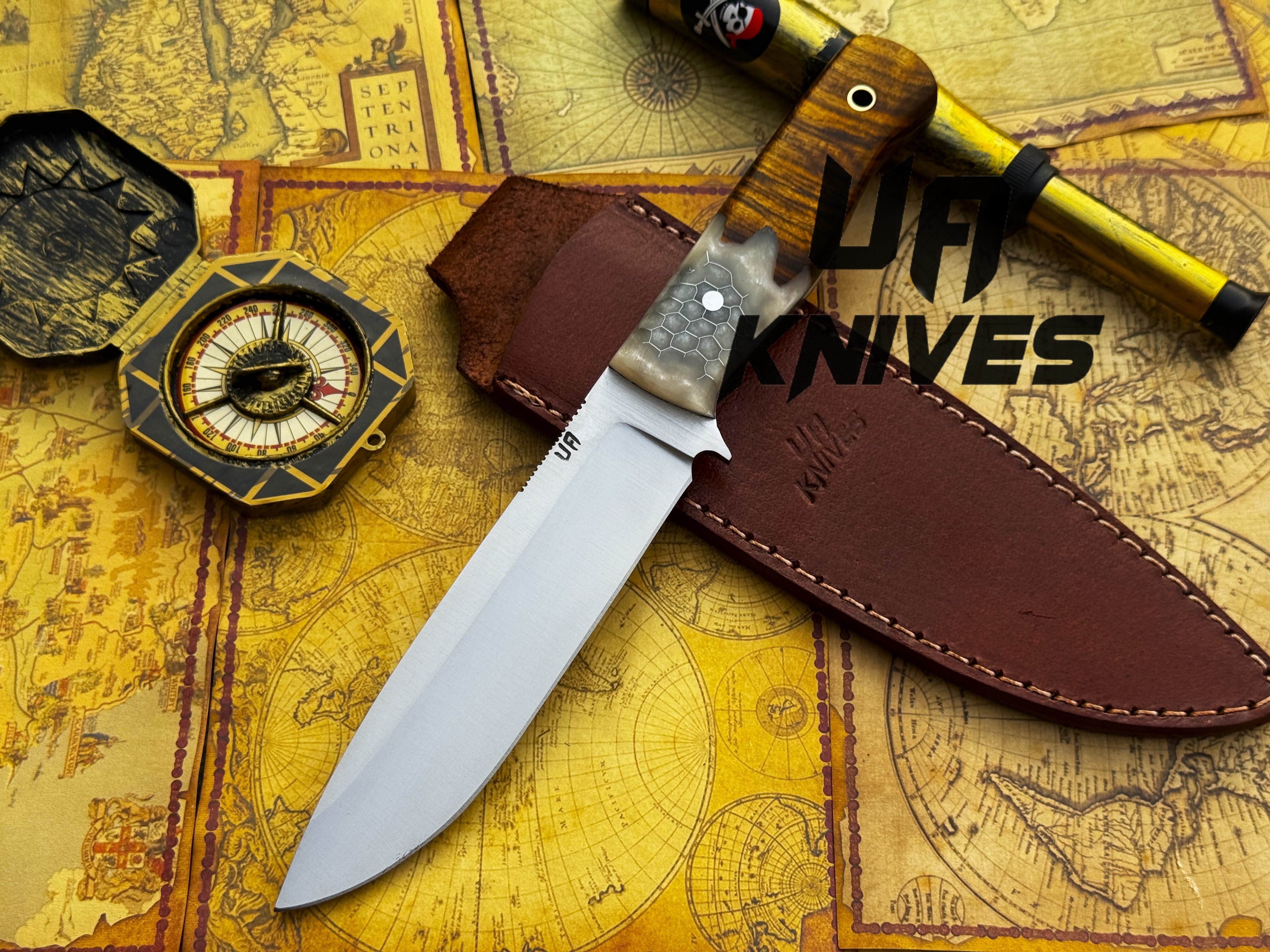 UA Knives Camp Quest handmade 12-inch camping and hunting knife with a sheath, featuring a durable blade and ergonomic handle.