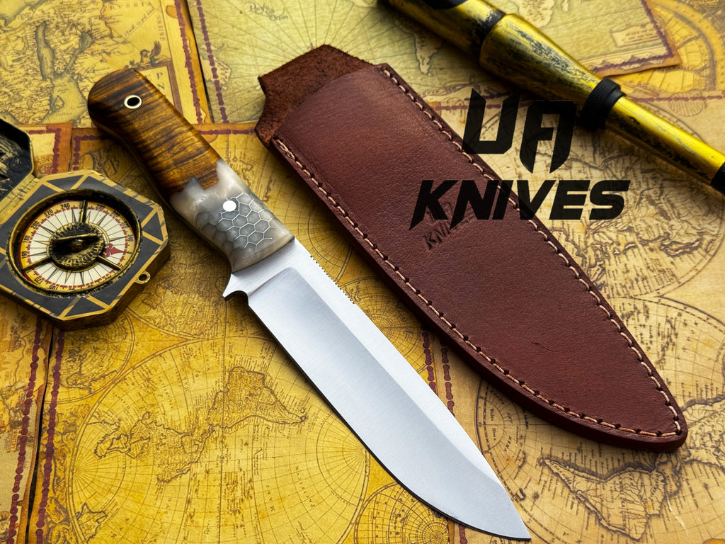 Handmade UA Camp Quest 12-inch camping and hunting knife with sheath, featuring a sturdy blade and ergonomic handle.
