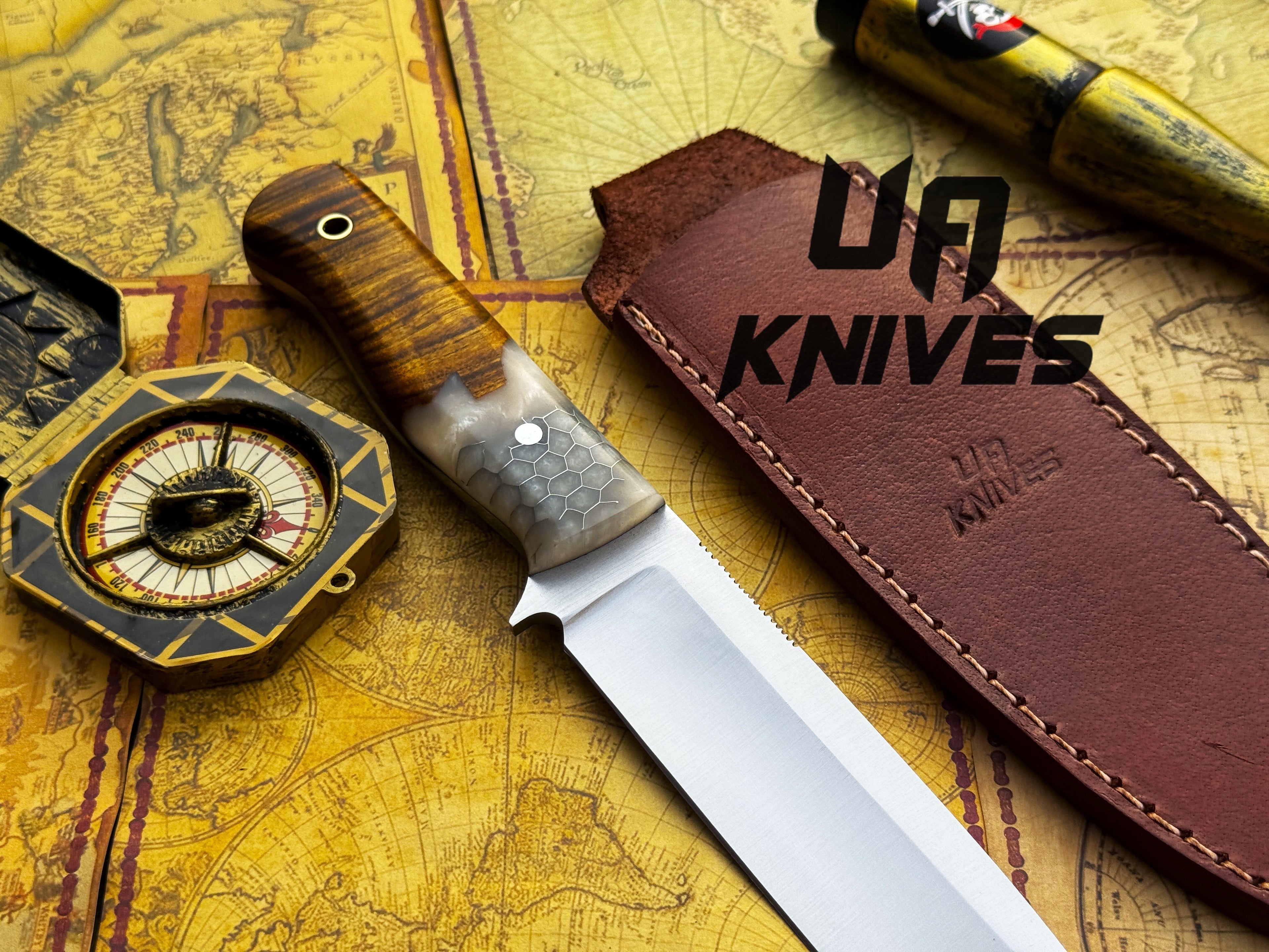 Handmade UA Camp Quest 12-inch camping and hunting knife with sheath, featuring a sturdy blade and durable handle.