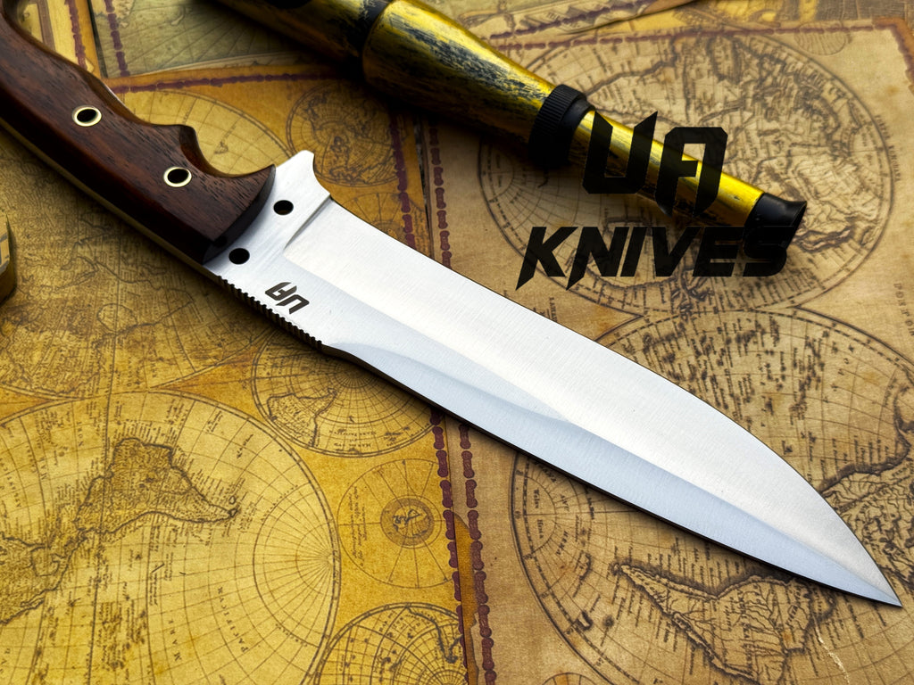 UA Knives Bushcraft Pro hunting knife with a 12-inch hand-forged full tang blade and wooden handle for outdoor survival.