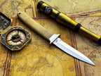 UA Iron Fang stainless steel camping knife with a textured handle and sharp blade, ideal for outdoor camping and survival tasks.
