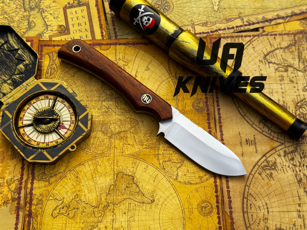 UA Knives Cobra Strike camping knife with handmade lightweight blade and sheath, featuring a textured handle and metal blade.