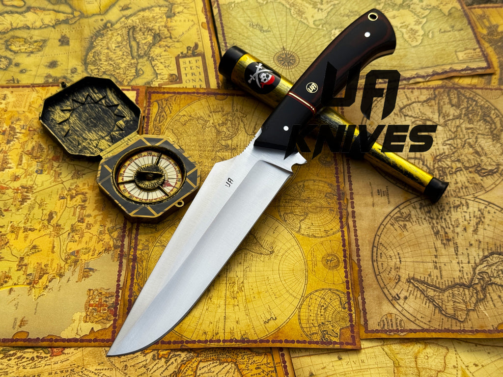 UA Dragons Tooth handmade Bowie hunting knife with leather sheath, featuring a detailed dragon tooth motif and polished blade.