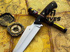 UA Knives Dragons Tooth handmade Bowie hunting knife with sheath, featuring a detailed blade and wooden handle.