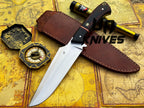 UA Knives Dragons Tooth handmade Bowie hunting knife with leather sheath, featuring a detailed blade and rustic wooden handle.