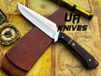 UA Knives Dragons Tooth handmade Bowie hunting knife with leather sheath, featuring a detailed blade and sturdy handle.
