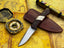 UA Knives Silver Myst stainless steel camping skinning knife with sheath, featuring a sleek design for outdoor survival tasks.