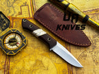 UA Knives Silver Myst stainless steel camping skinning knife with sheath, featuring a sharp blade and ergonomic handle.