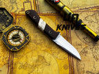 UA Knives Silver Myst stainless steel camping skinning knife with sheath, featuring a sharp blade and ergonomic handle.
