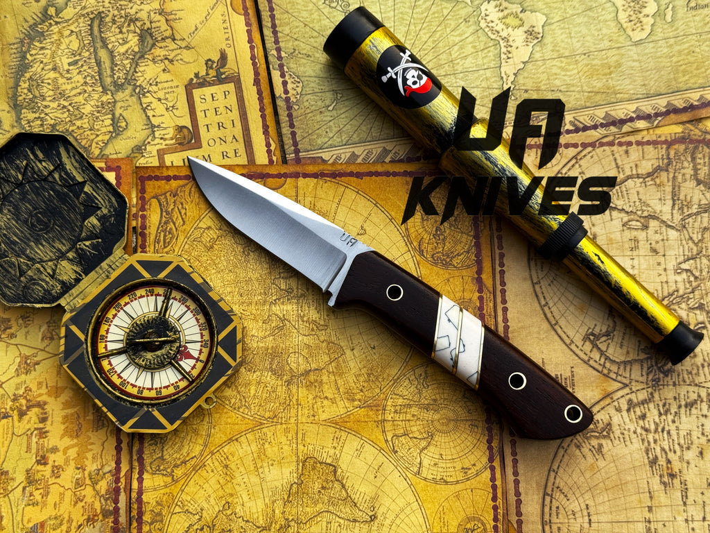 UA Silver Myst stainless steel camping knife with sheath, designed for outdoor survival and camping tasks.