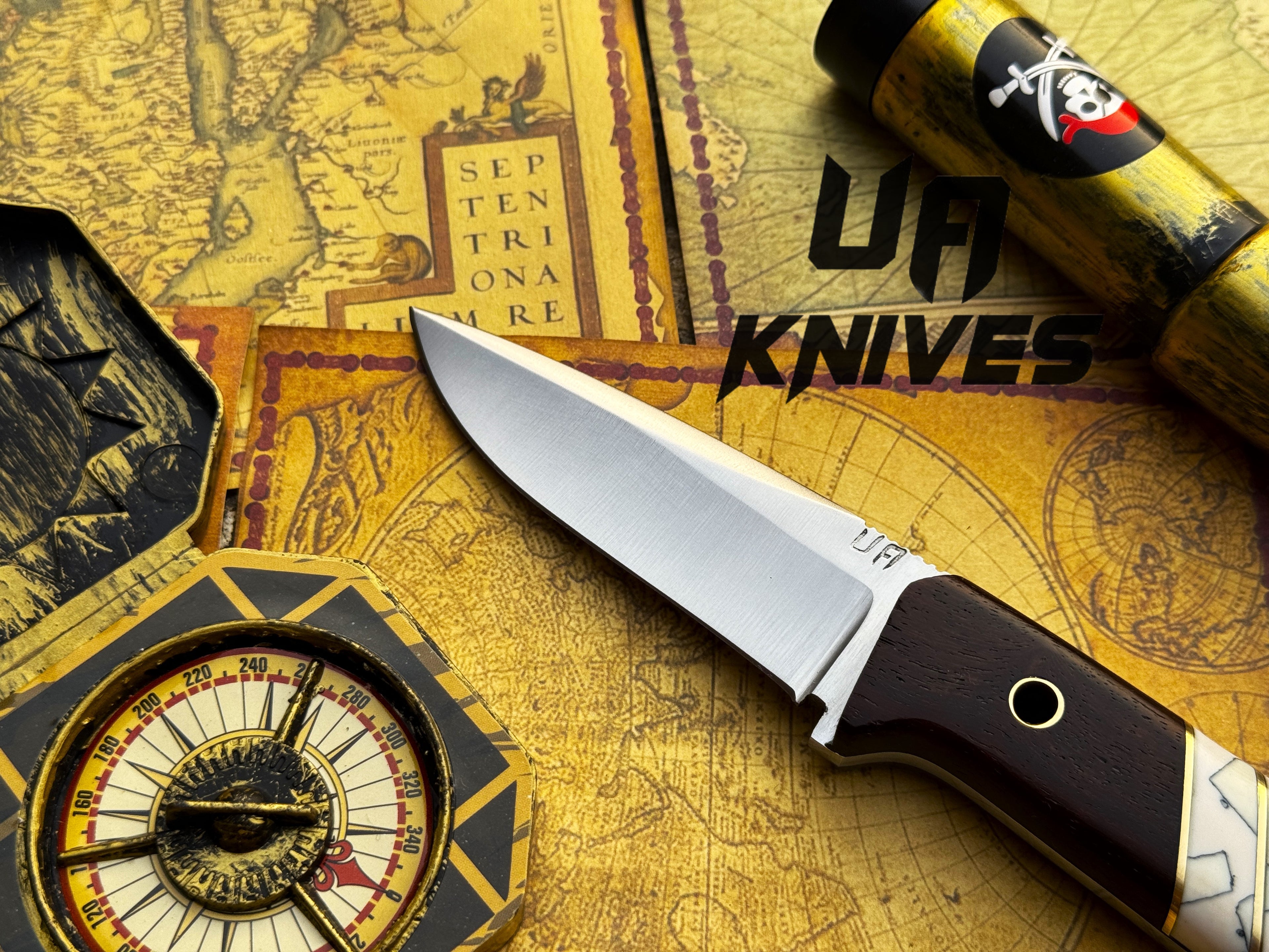 UA Silver Myst stainless steel camping skinning knife with sheath, featuring a sharp blade and durable handle for outdoor use.