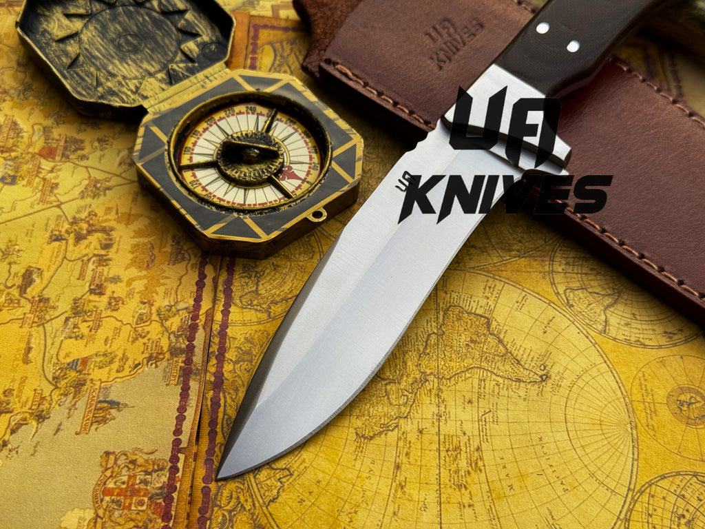 UA Knives Bear Claw hunting knife with hand-forged blade and G10 Micarta handle, showcasing rugged outdoor tool craftsmanship.
