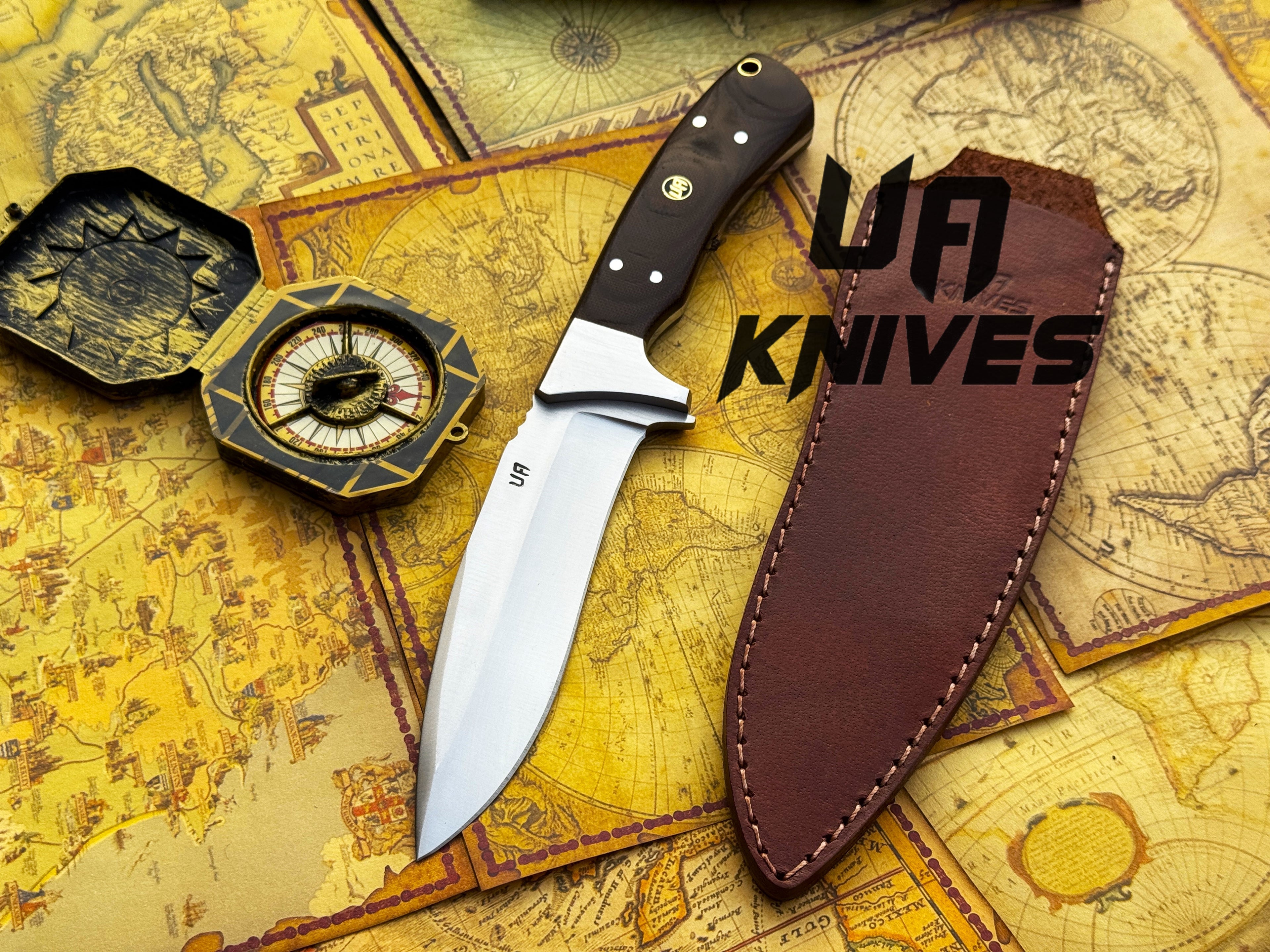 UA Knives Bear Claw hunting knife with hand-forged blade and G10 Micarta handle, showing the detailed blade and textured handle.