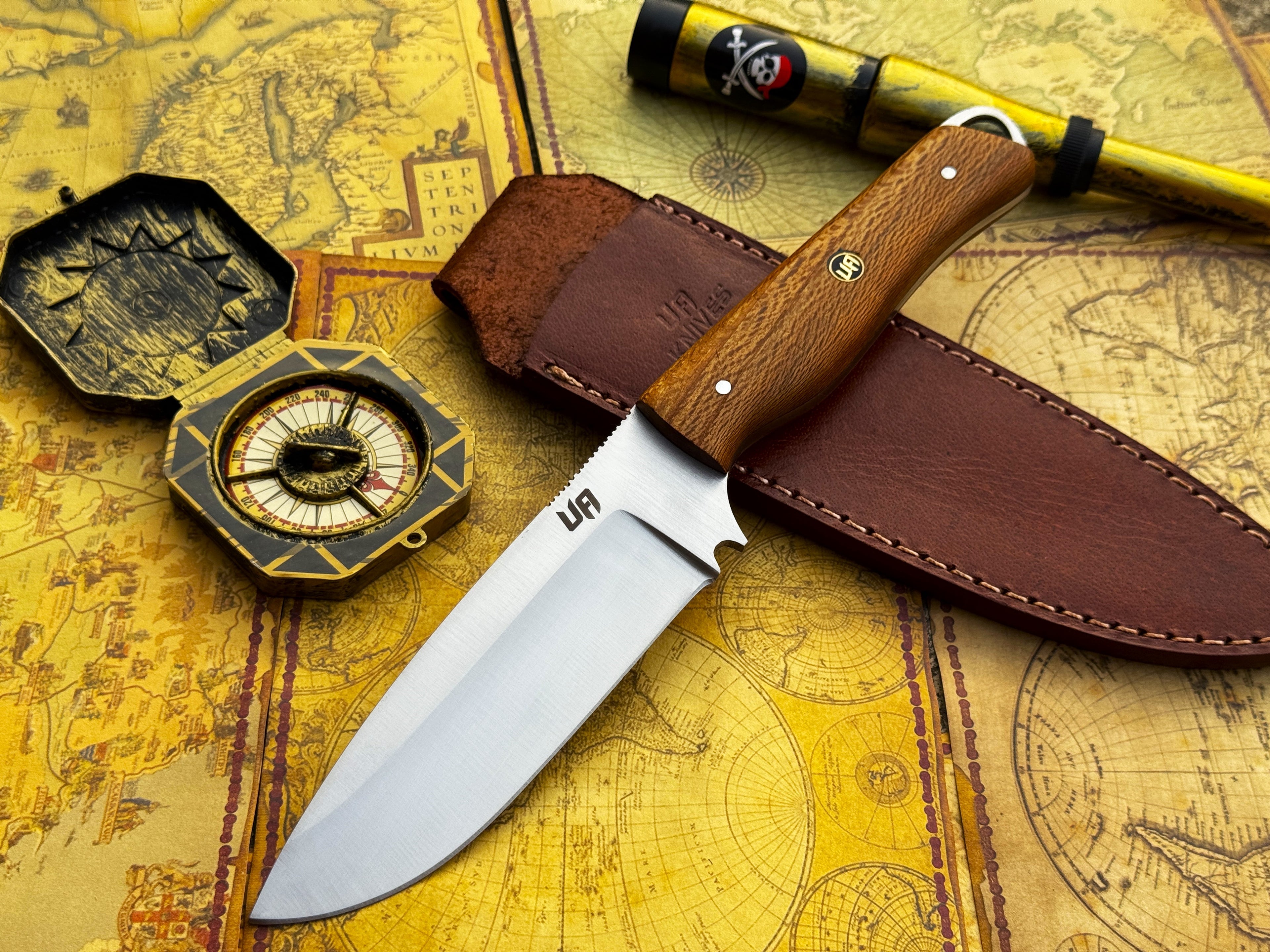 UA Knives Nature Nook hand-forged stainless steel hunting knife with a leather handle and outdoor-ready blade.
