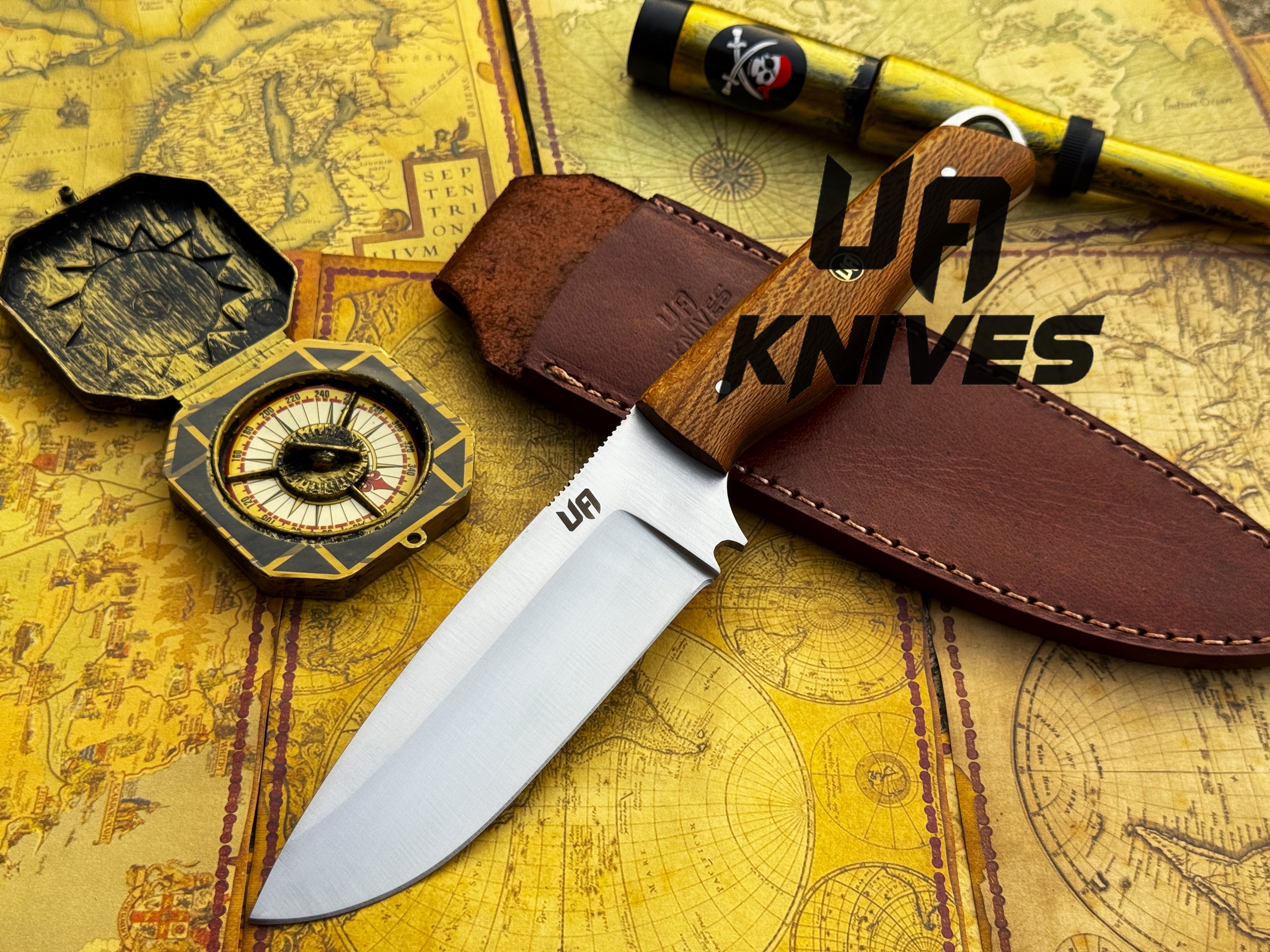 UA Nature Nook stainless steel hunting knife with a forged handle and leather sheath, designed for outdoor hunting activities.