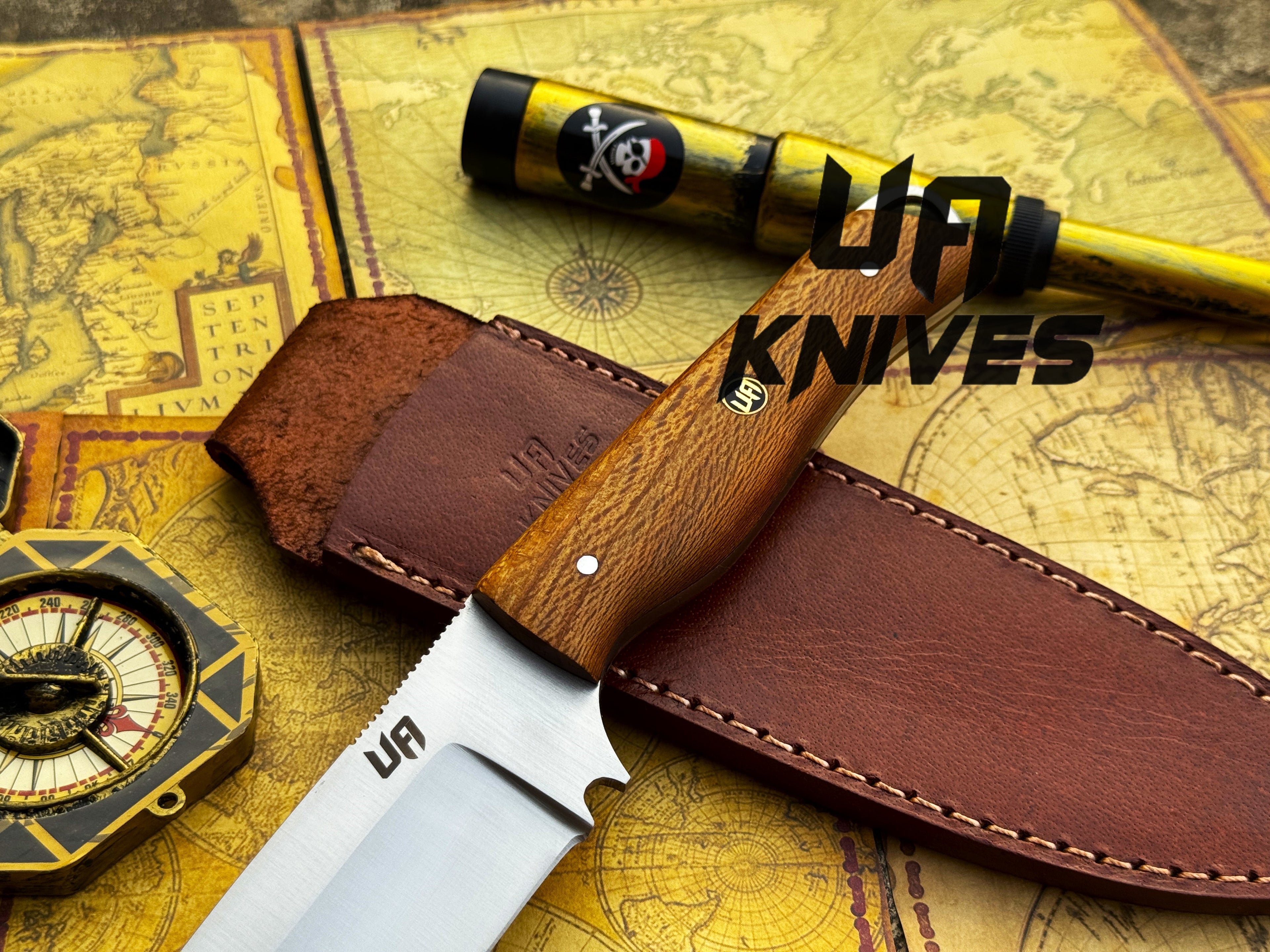 UA Knives Nature Nook hunting knife with a hand-forged stainless steel blade and wooden handle, displayed on a natural background.