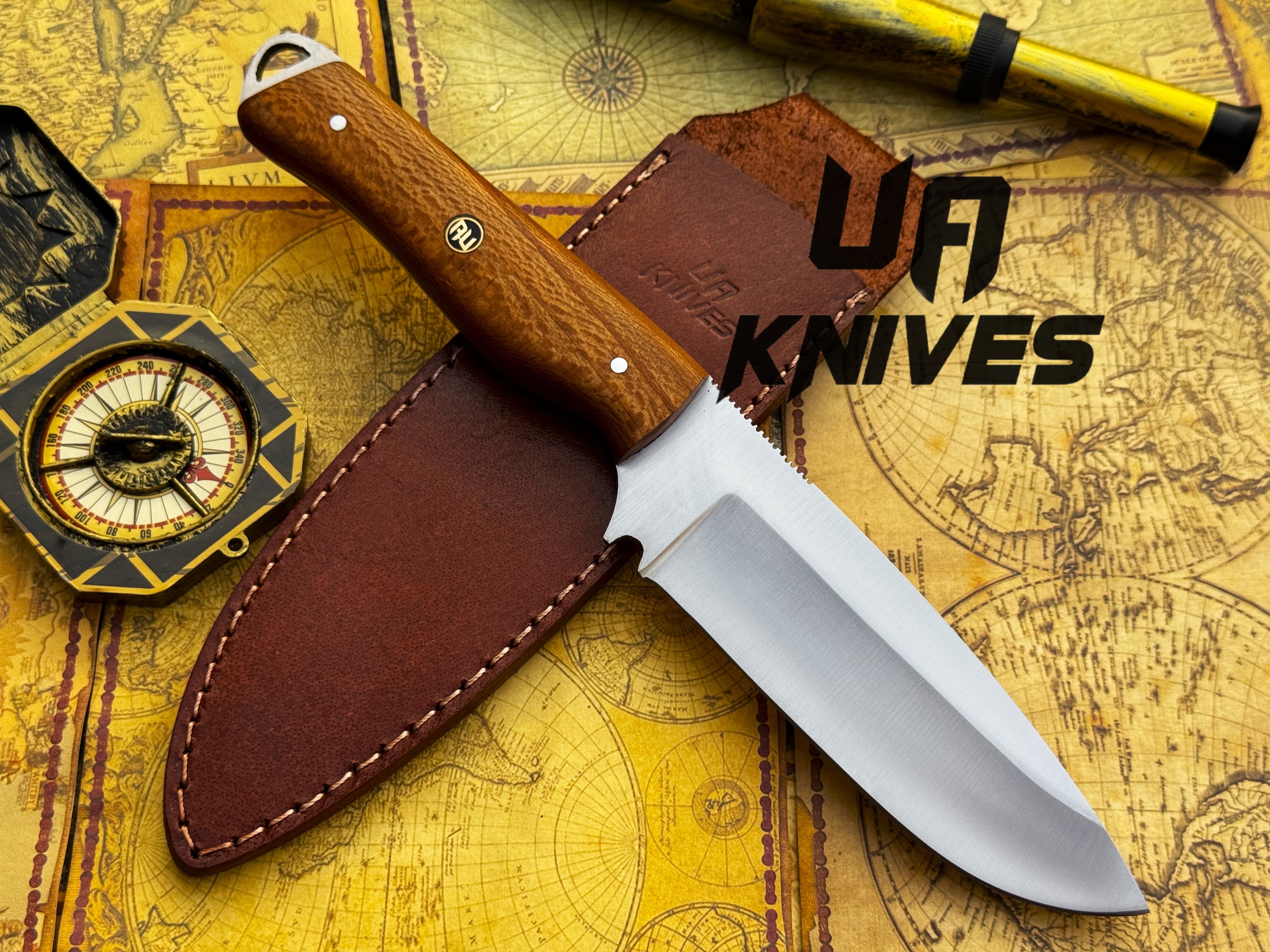 UA Knives Nature Nook hand-forged stainless steel hunting knife with a textured handle and sharp blade for outdoor use.
