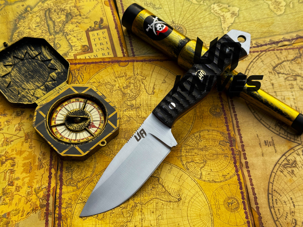 UA Silver Myst camping hunting knife with hand-forged 12C27 blade and leather sheath, designed for outdoor and camping adventures.