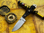 UA Silver Myst camping hunting knife with hand-forged 12C27 blade and leather sheath, designed for outdoor and camping adventures.