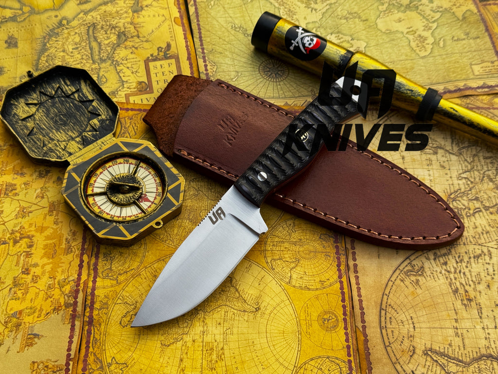 UA Silver Myst camping knife by UA Knives, hand-forged 12C27 steel hunting knife with sheath, featuring a sleek silver finish.