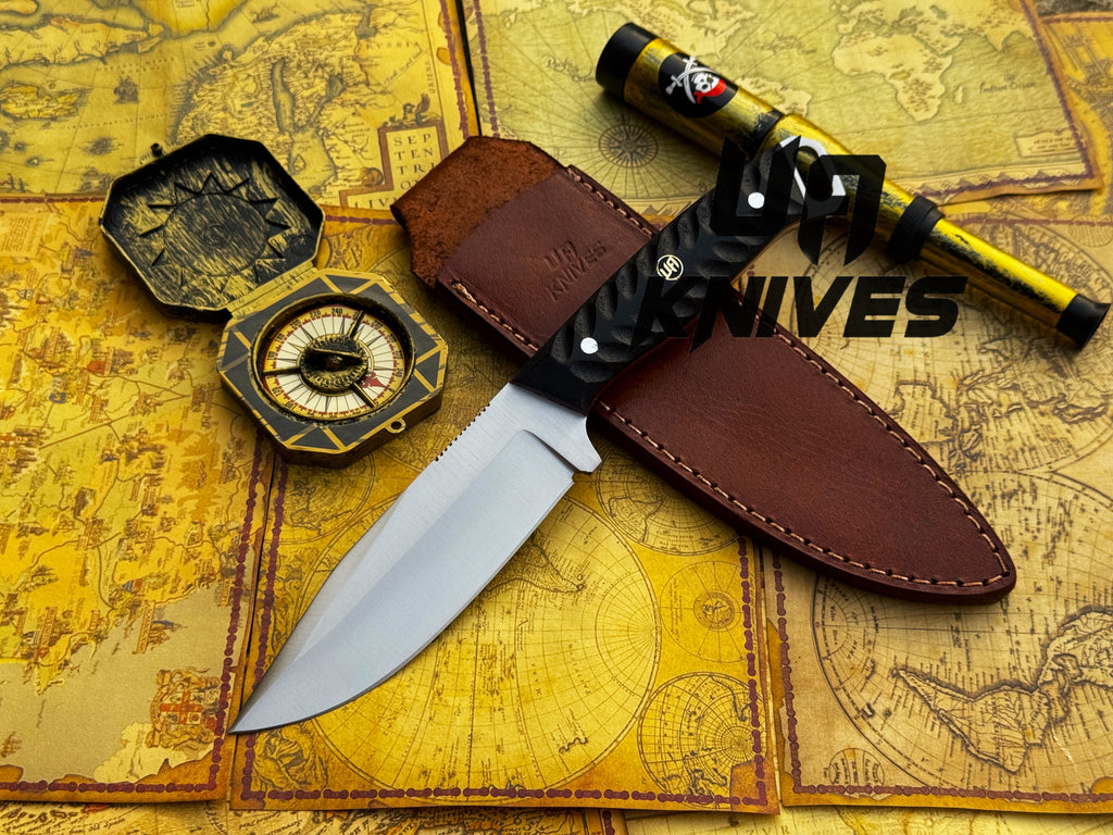 UA Night Stalker hunting knife with 12C27 stainless steel blade and ergonomic handle, designed for outdoor hunting and survival tasks.