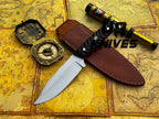 UA Night Stalker hunting knife with 12C27 stainless steel blade and ergonomic handle, designed for outdoor hunting and survival tasks.