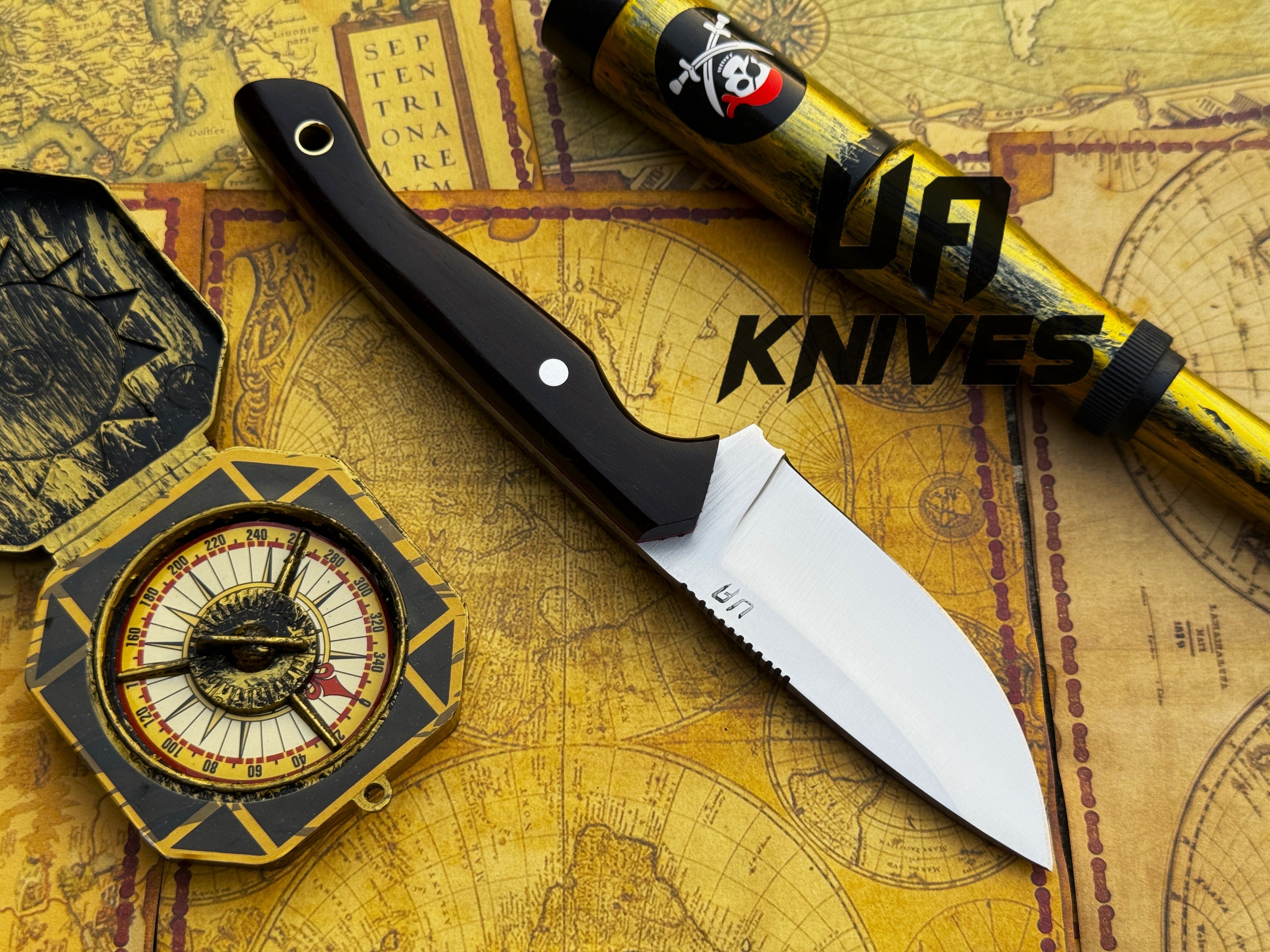 UA Oakheart handmade survival and bushcraft camping knife with a wooden handle and sharp blade on a wooden surface.
