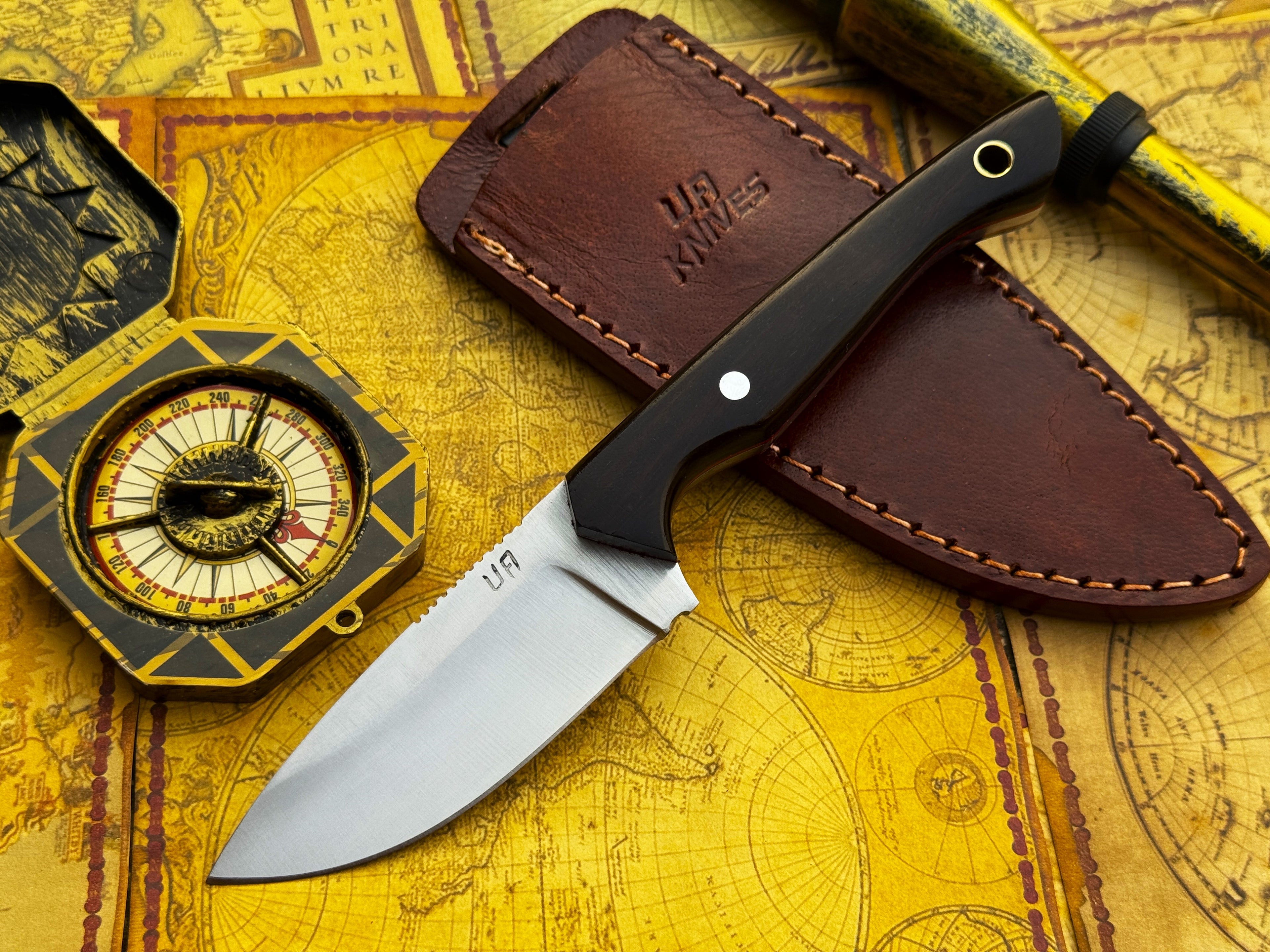 UA Oakheart handmade camping and survival knife by UA Knives, featuring a durable blade and ergonomic handle for outdoor bushcraft.