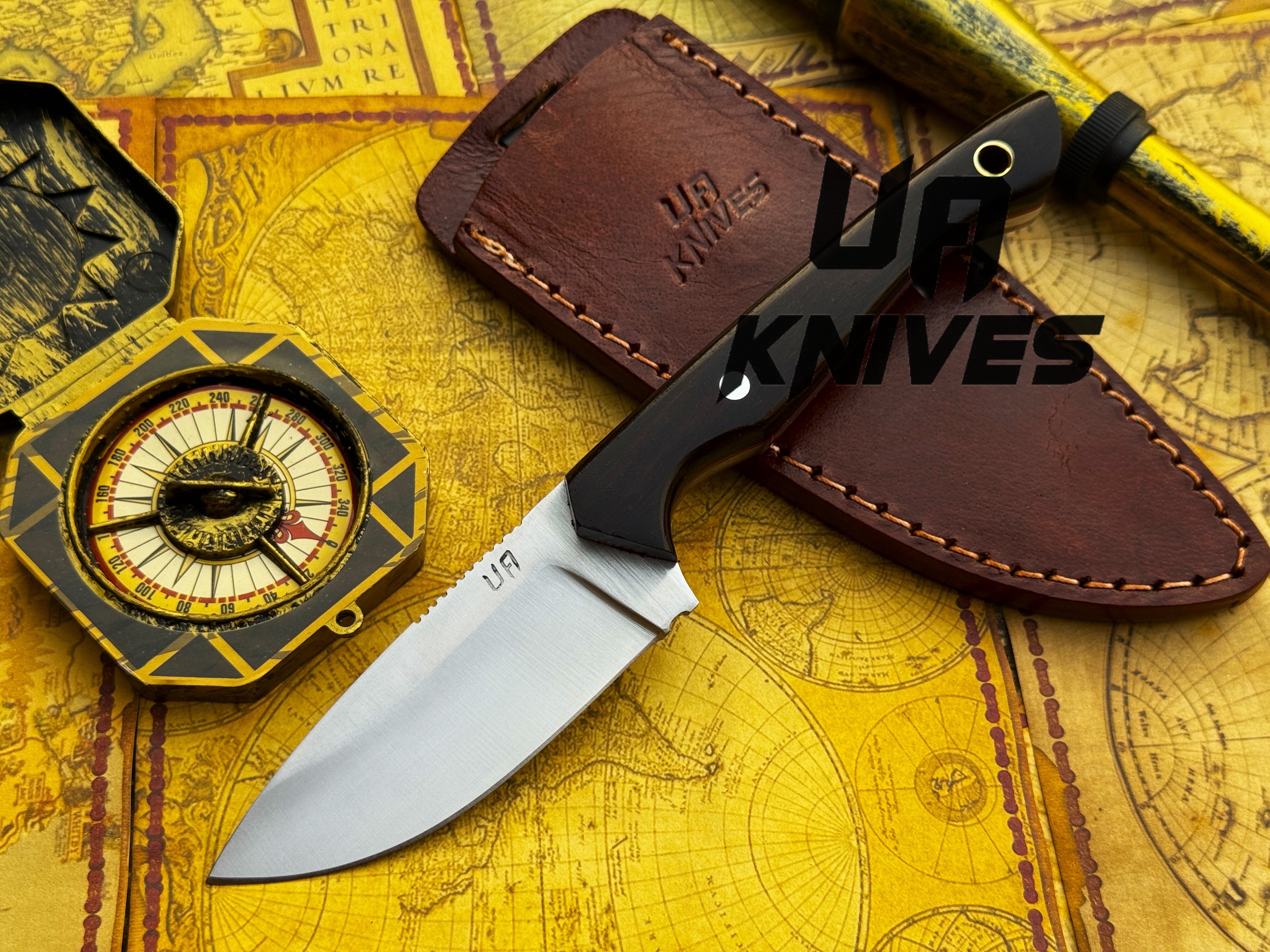 Handmade UA Oakheart camping and survival knife with a wooden handle and sharp blade, ideal for bushcraft and outdoor camping.
