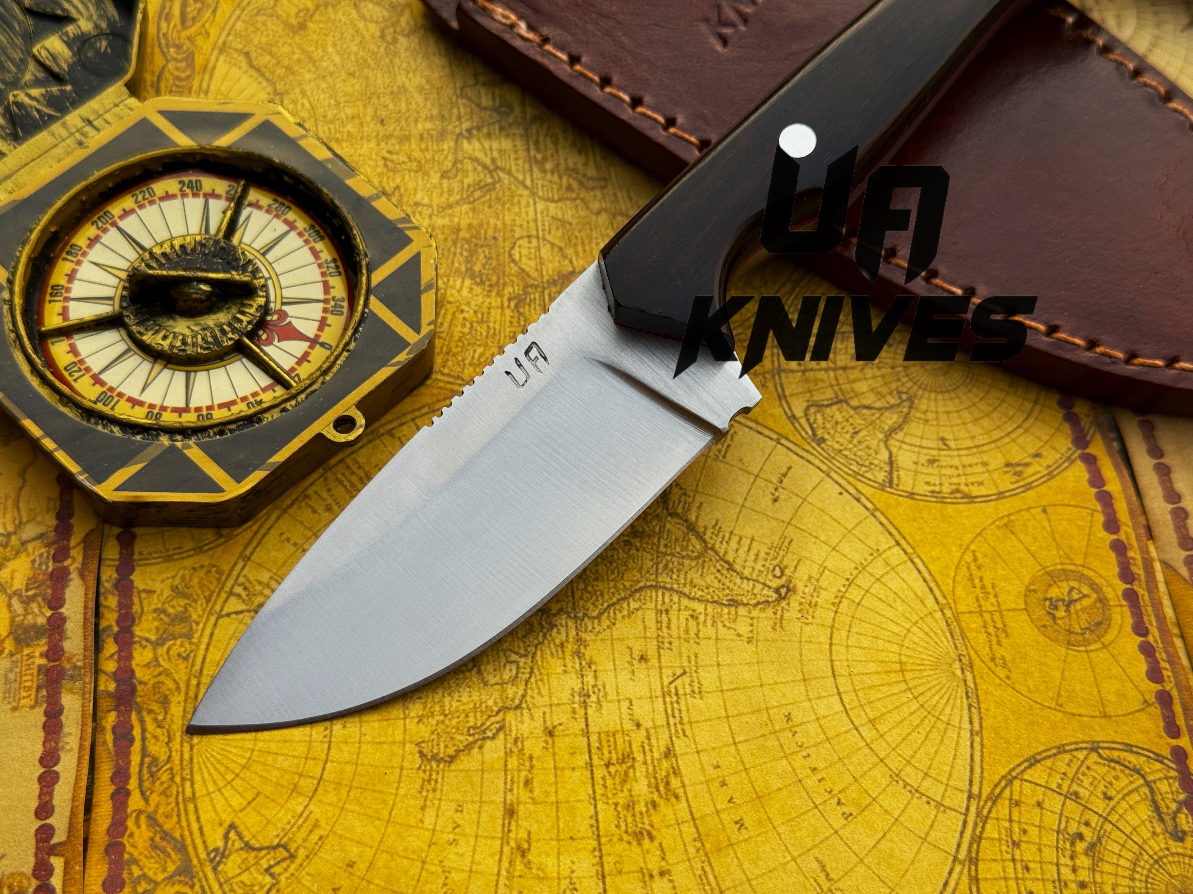 UA Oakheart handmade survival knife by UA Knives, camping knife with a wooden handle and sharp blade for bushcraft and outdoor use.