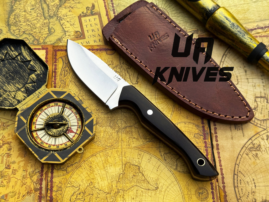 Handmade UA Oakheart camping survival and bushcraft knife with a wooden handle and fixed blade for outdoor adventures.