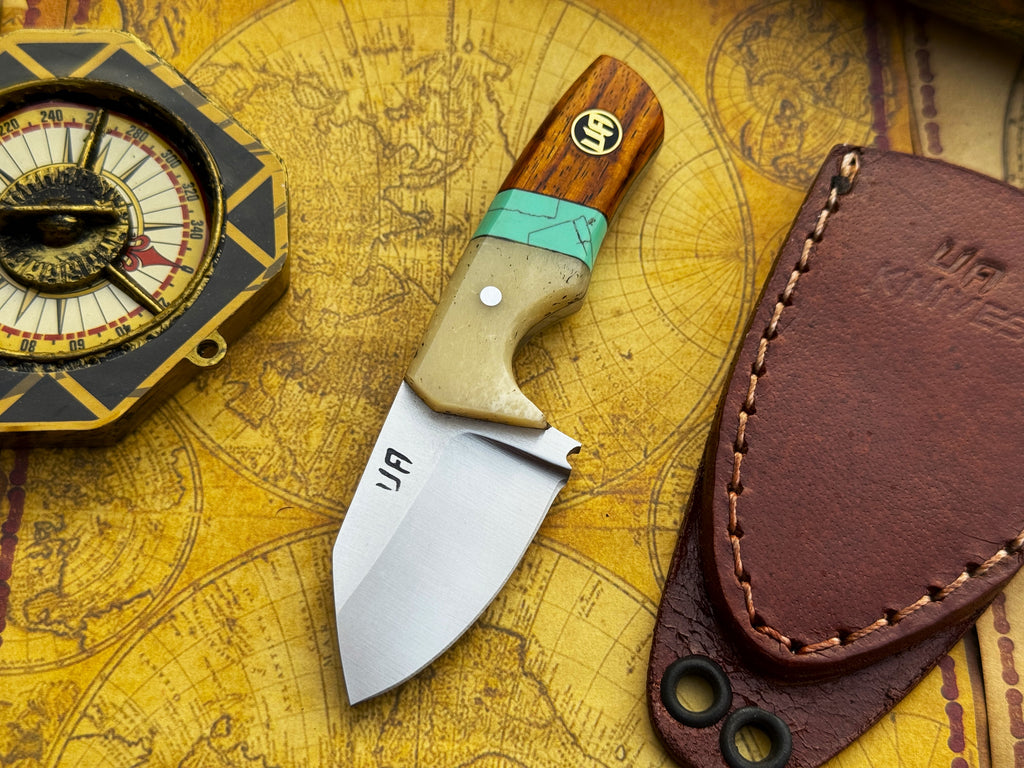 UA Knives handmade EDC utility knife with pocket protector, featuring a sleek blade and durable handle for everyday carry.