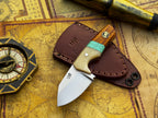 Knife with wooden handle and leather sheath on an old map
