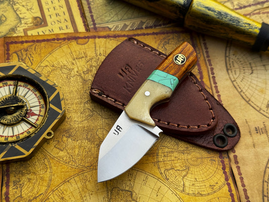 Knife with wooden handle and leather sheath on an old map