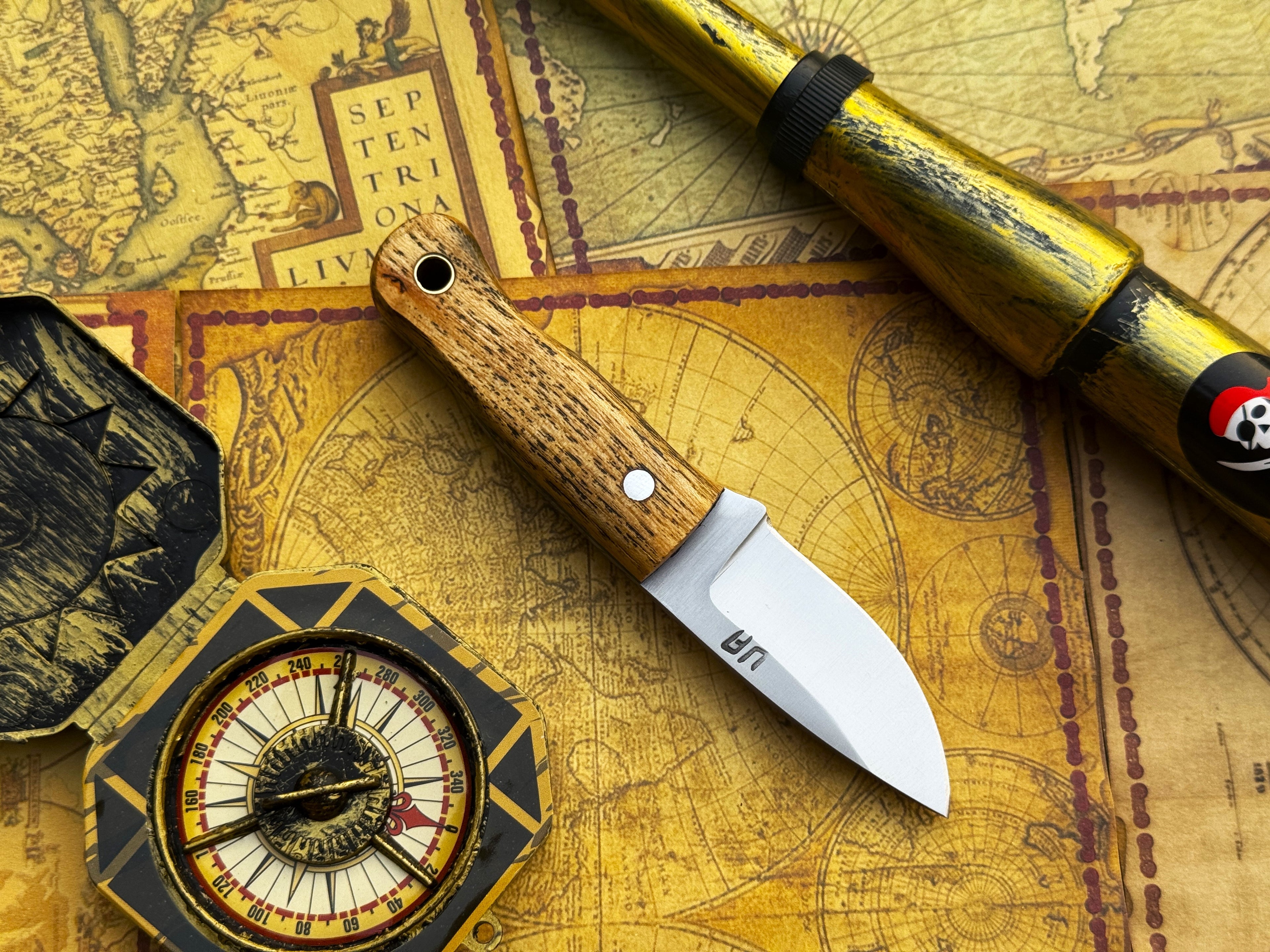 Handmade UA Devil Dust EDC Utility Knife with a textured handle and sharp blade, designed for everyday carry and durability.