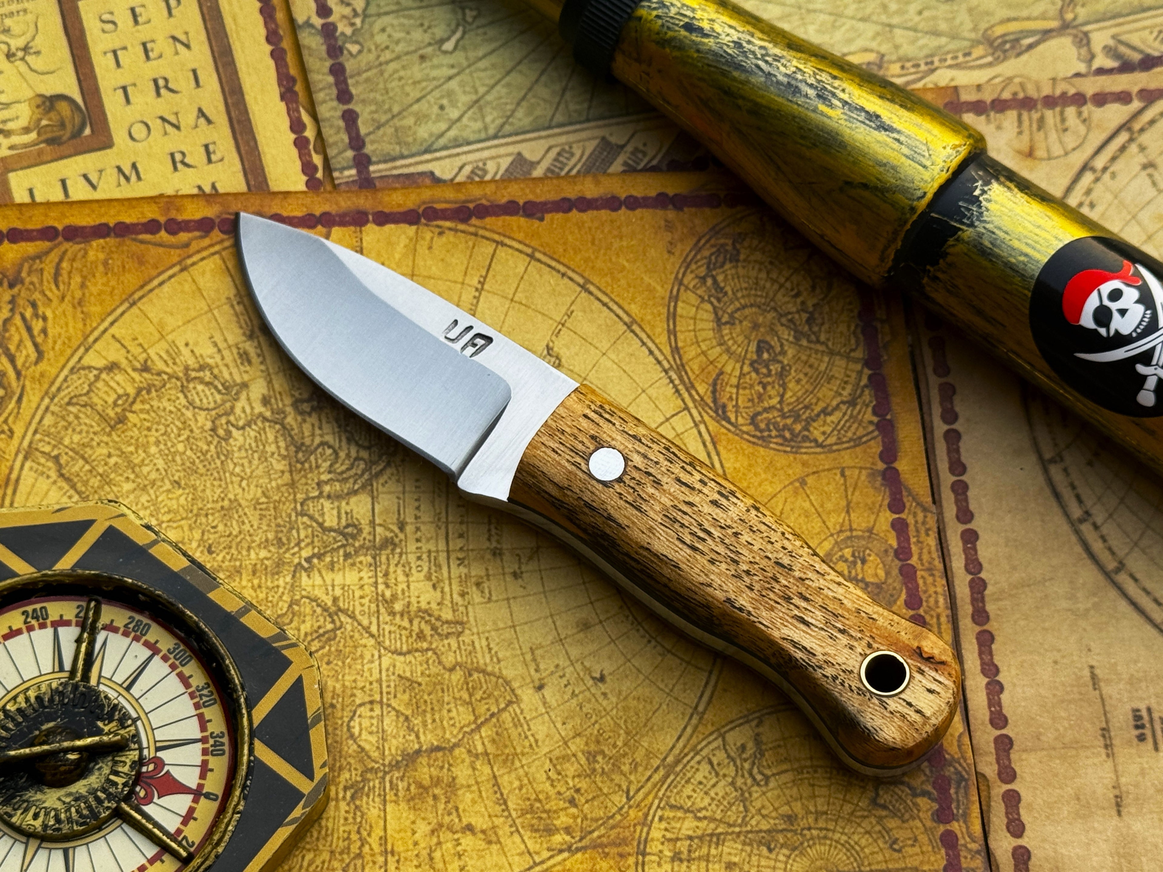 Handmade UA Devil Dust EDC Utility Knife with textured handle and sharp blade, designed for everyday carry and versatile use.
