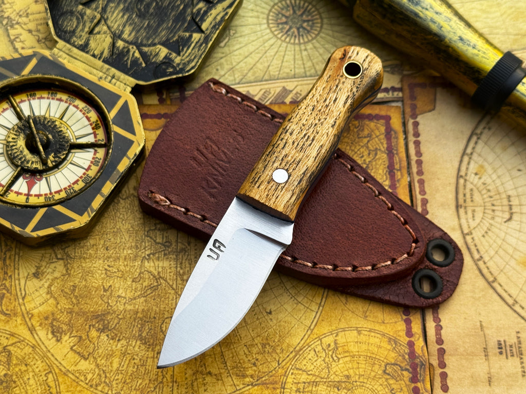 UA Knives Devil Dust handmade EDC utility knife with a sleek blade and ergonomic handle, ideal for everyday carry.