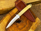 UA Iron Fang stainless steel camping knife with a textured handle and sharp blade, ideal for outdoor camping and survival tasks.