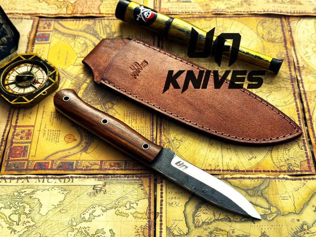 UA Knives True Guide camping knife with hand-forged Scandinavian blade and ergonomic rosewood handle, ideal for outdoor camping.