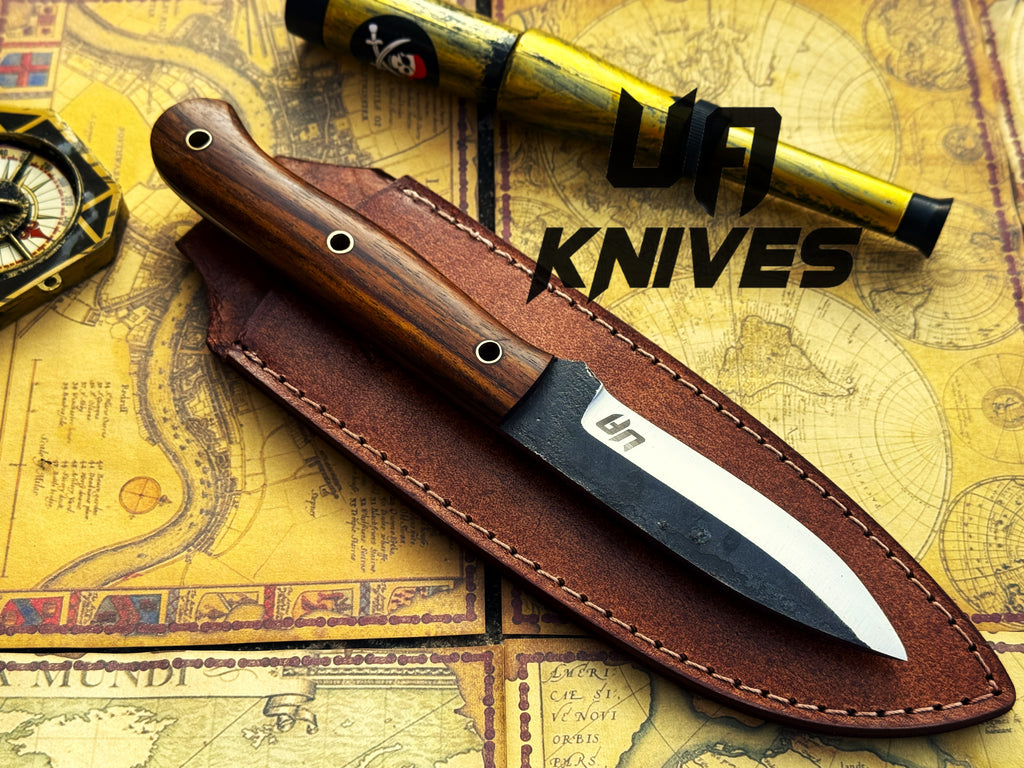 UA Knives True Guide Scandinavian camping knife with hand-forged blade and ergonomic rosewood handle for outdoor survival and camping.