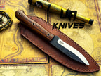 UA Knives True Guide Scandinavian camping knife with hand-forged blade and ergonomic rosewood handle for outdoor survival and camping.
