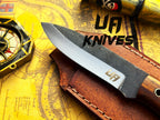 UA Knives True Guide camping knife with hand-forged Scandinavian blade and ergonomic rosewood handle for outdoor use.