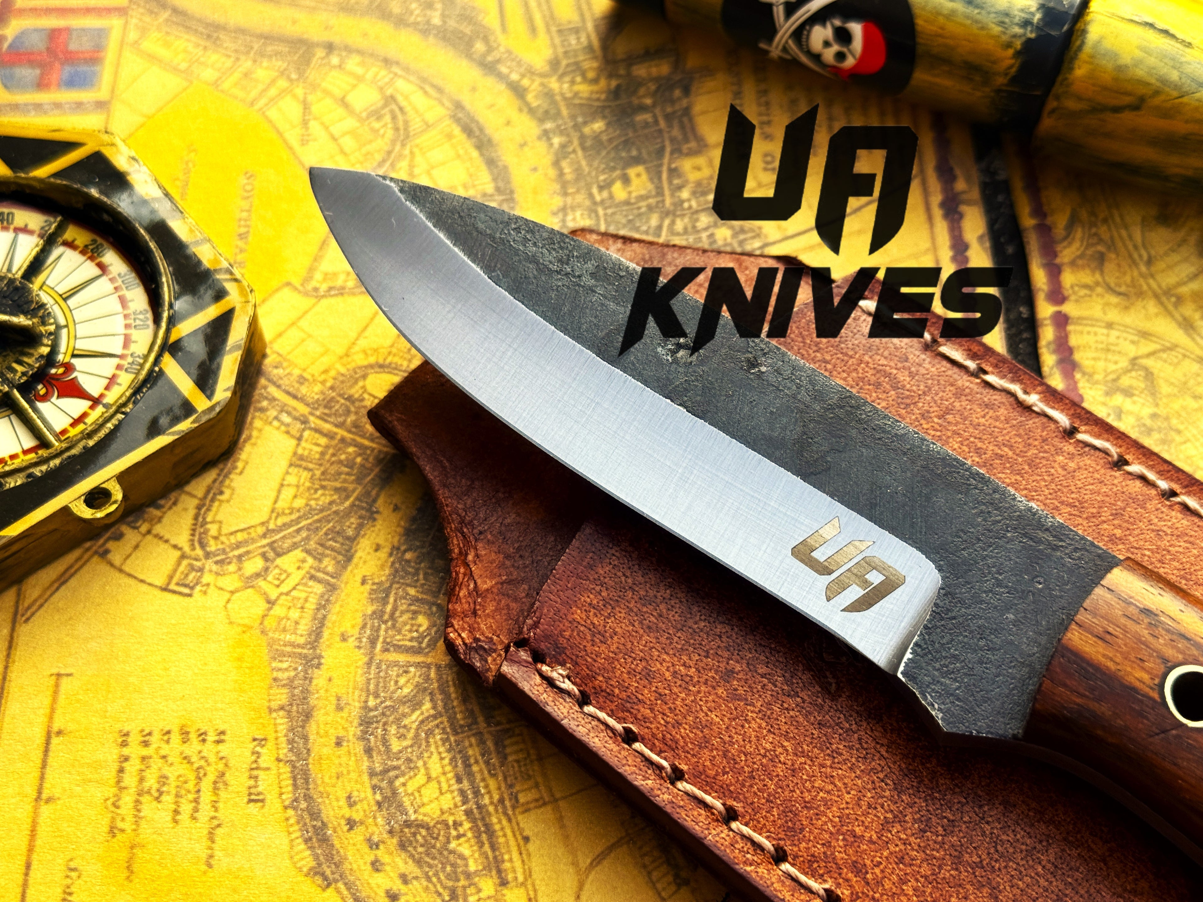 UA Knives True Guide camping knife with hand-forged Scandinavian blade and ergonomic rosewood handle for outdoor use.
