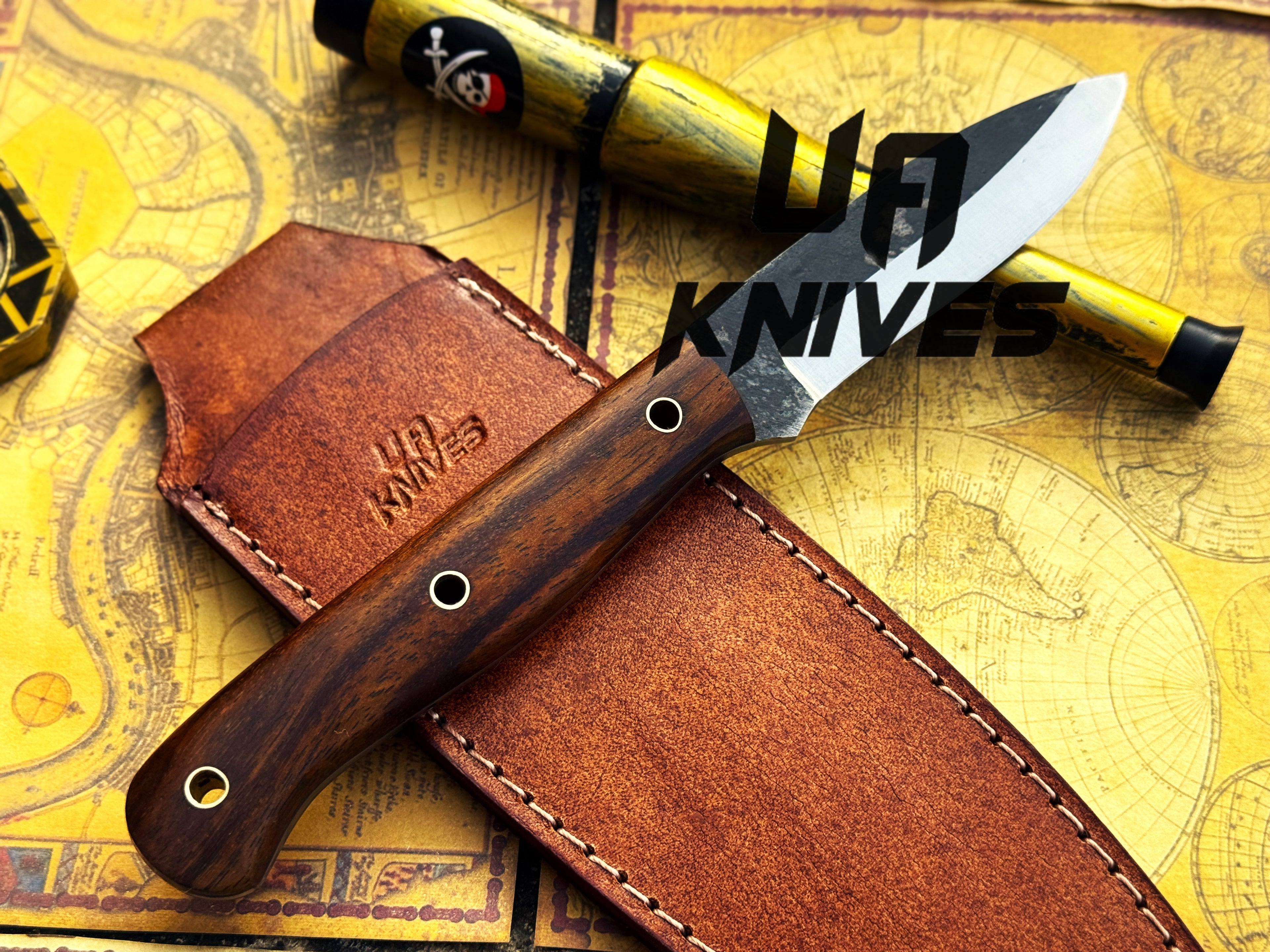 UA Knives True Guide camping knife with hand-forged Scandinavian blade and ergonomic rosewood handle for outdoor use.