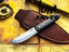 UA Eagle Eye hand-forged Pakku style stainless steel camping knife with full tang and sheath, ideal for outdoor survival and camping.